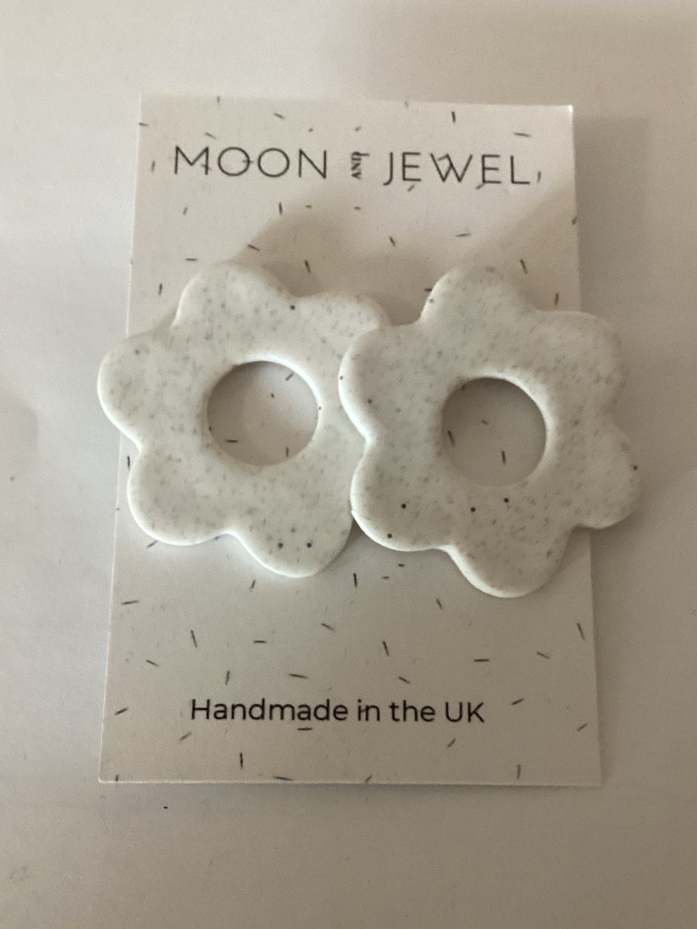 Moon + Jewel White Speckled Flower Hoop Earrings